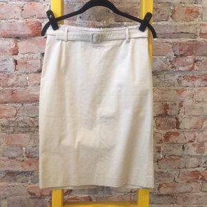 Straight line beige skirt with fabric belt.